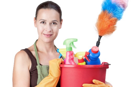 Cleaner carrying out routine home cleaning in an SW17 property