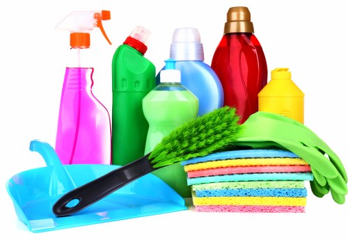 Cleaner carrying supplies for a one-off cleaning visit in SW17 home