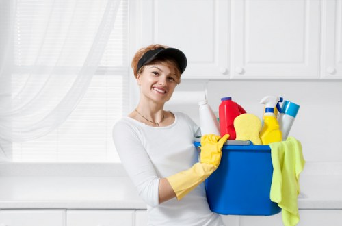 Cleaner working in a converted flat typical of SW17 properties