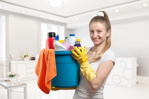 Cleaner preparing a kitchen for end of tenancy cleaning in SW17